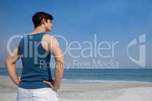 Man looking at sea from beach