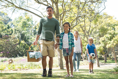 Family arriving in the park for picnic