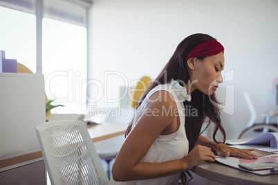 Businesswoman working at office desk