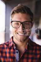 Close up portrait of smiling businessman in balcony