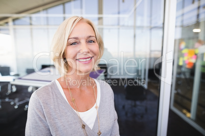 Portrait of mature businesswoman smiling in office