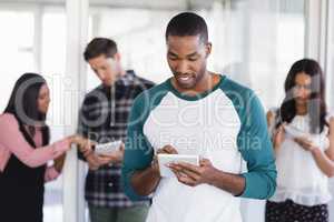 Businessman using digital tablet at office