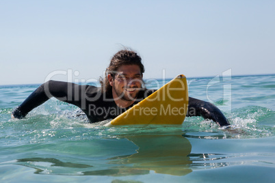 Surfer surfboarding in the sea
