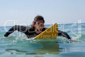 Surfer surfboarding in the sea