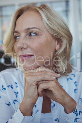 Thoughtful businesswoman sitting at office