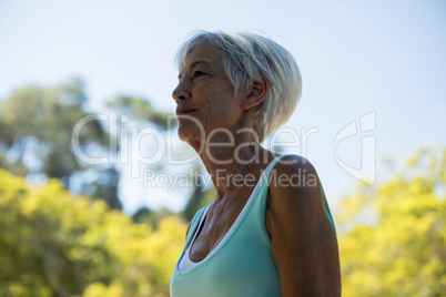 Senior woman standing in the park