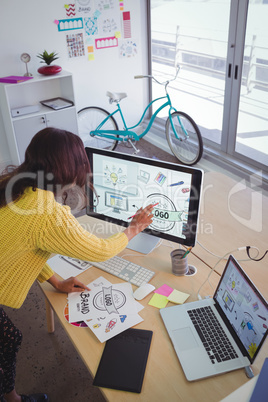 Female graphic designer working in creative office