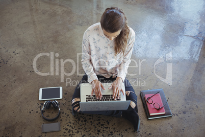 Entrepreneur with laptop working on floor
