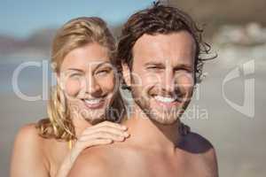 Portrait of smiling couple at beach