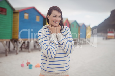 Smiling woman standing at beach