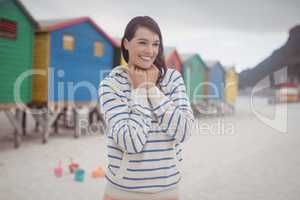 Smiling woman standing at beach