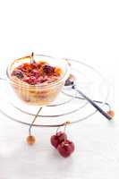 A desert of Clafoutis with cherry on a white background