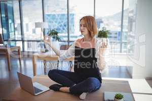 Beautiful executive meditating on desk