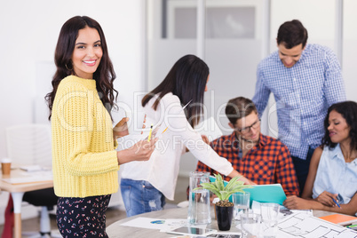 Side view of businesswoman with colleagues