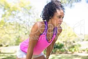Exhausted jogger woman relaxing in the park