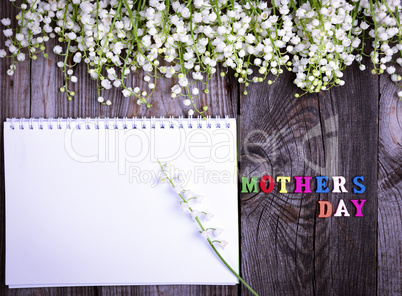 Abstract wooden background with festive inscription mother's day
