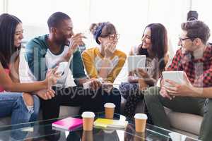 Happy business people with tablet computers