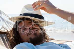 Smiling man relaxing in hammock