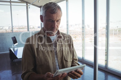 Businessman using digital tablet in modern office