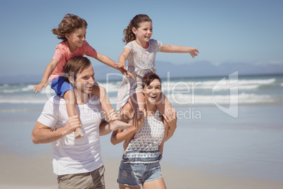 Cheerful family enjoying at beach