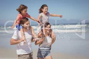 Cheerful family enjoying at beach