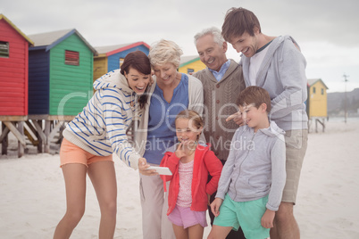 Happy multi-generation family taking selfie