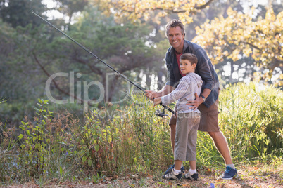 Portait of father and son fishing