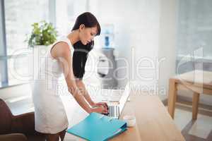 Attentive executive using laptop at desk