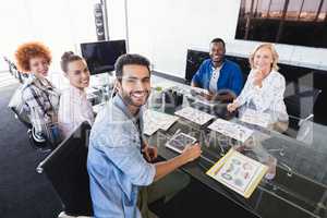 High angle portrait of business people sitting at creative office