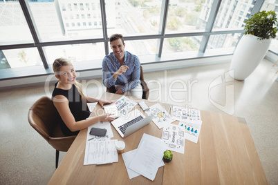 Overhead view of executives working at desk