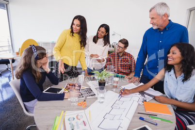 Business people discussing at desk