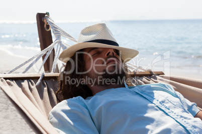 Man relaxing in hammock