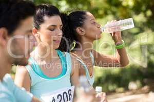 Marathon athletes having water