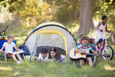 Children enjoying at campsite
