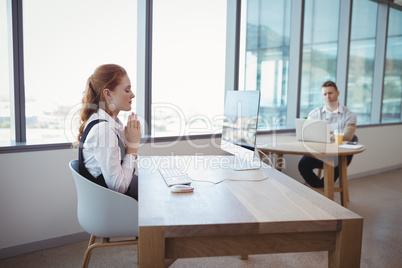 Executive meditating at desk