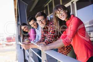 Portrait of smiling business colleagues in balcony