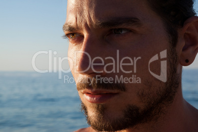 Close up of thoughtful man at beach