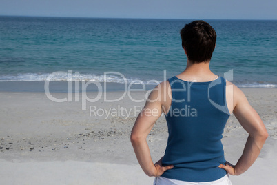 Man looking at sea from beach
