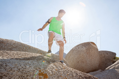 Man ready to jump from rock