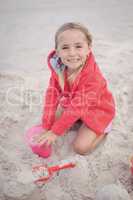 Portrait of smiling girl playing at beach