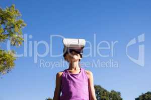 Girl using vr headset in the park