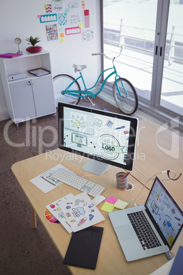 Technologies with drawings on desk in creative office