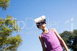 Girl using vr headset in the park