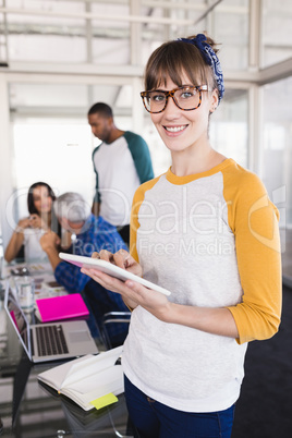 Portrait of businesswoman using tablet pc