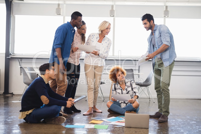 Colleagues discussing at creative office