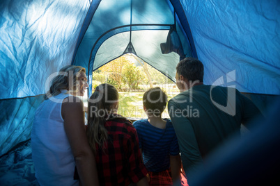 Family sitting in the tent