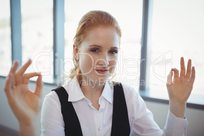 Portrait of smiling executive performing yoga