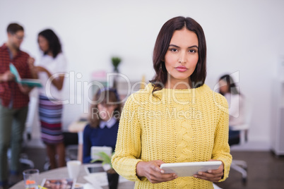 Portrait of businesswoman with tablet computer