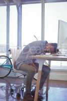 Tired businessman napping in office