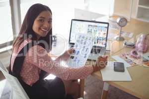 High angle portrait of businesswoman working at office